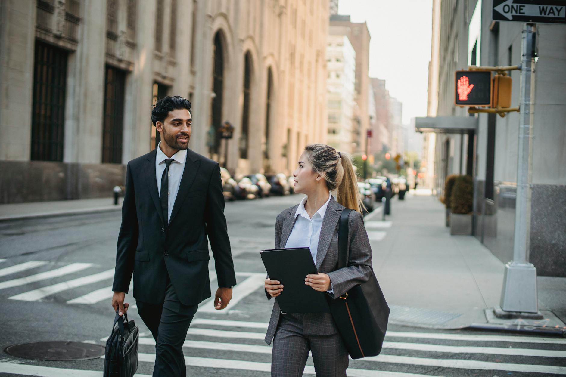 man and woman walking on the street